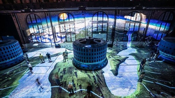 The generator hall at the Niagara Parks Power Station with the floor projection show running between the turbines