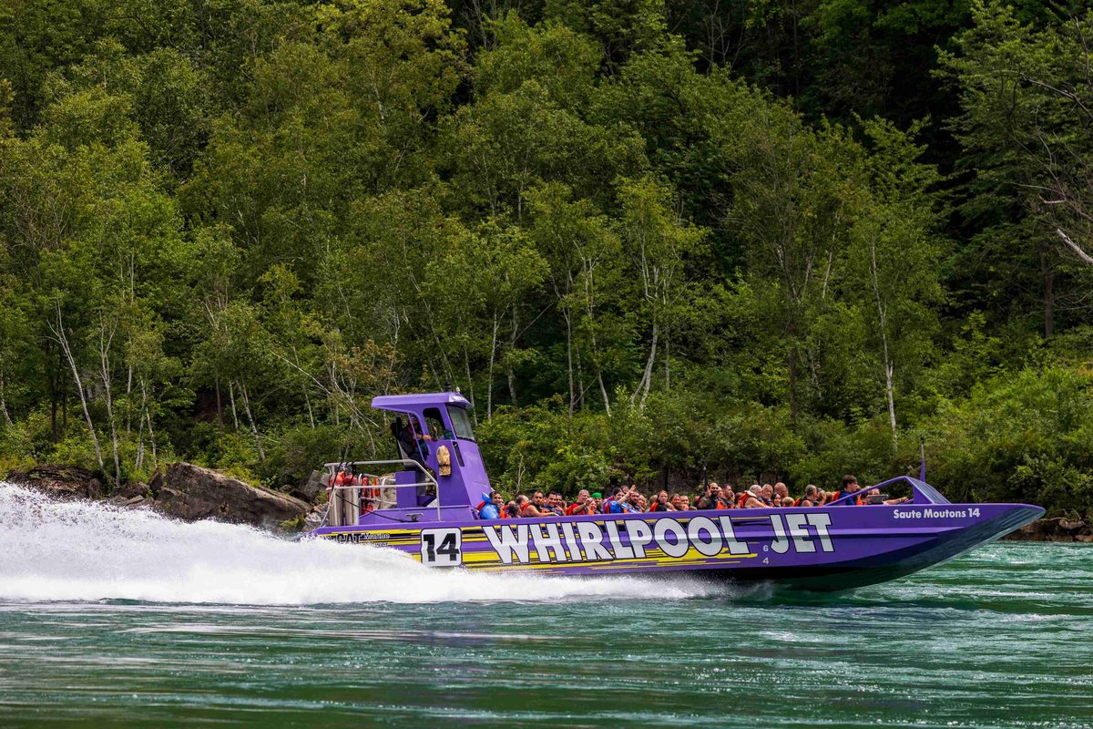 A Whirlpool Jet boat powering through the rapids on the Niagara River